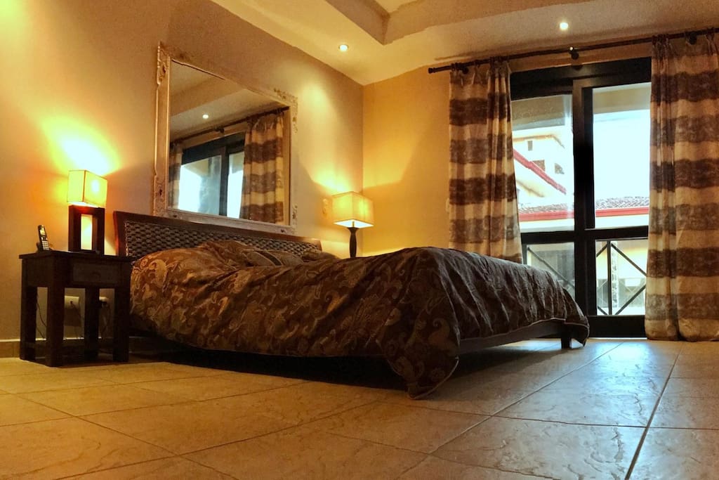 King master bedroom with large walk-in closet, full ensuite bath, terrace walk-out and large plasma TV