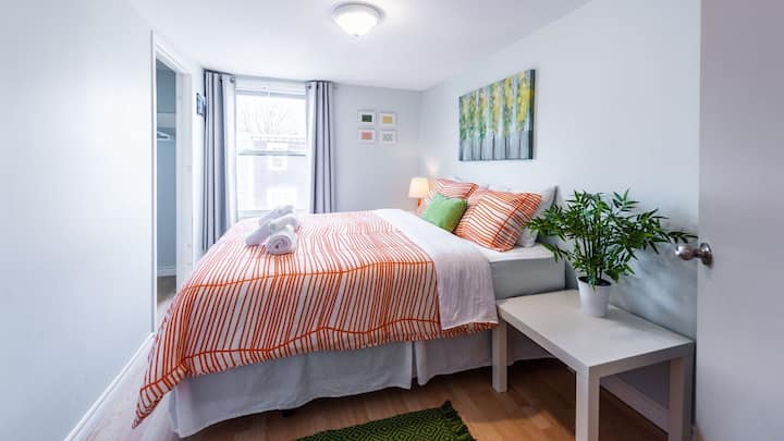 Last bedroom, also on the front of the house, with probably my favourite view of the city and Signal Hill. 

The mattress on this bed is a high-quality Stearns & Foster, replaced new in the spring of 2024. 
