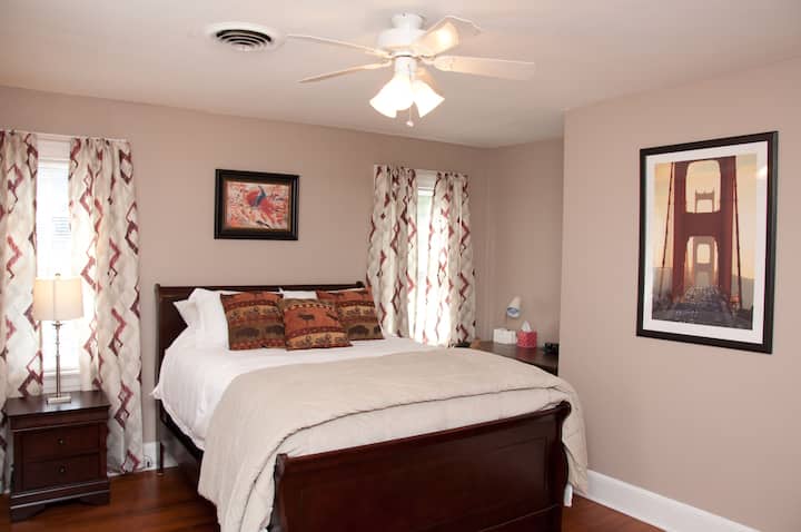 Front Bedroom - Features a queen size bed, located upstairs. This bedroom has a ceiling fan.