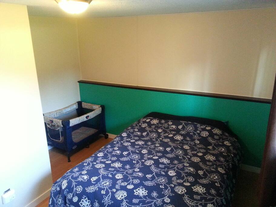 Queen size bad and space for playpen.