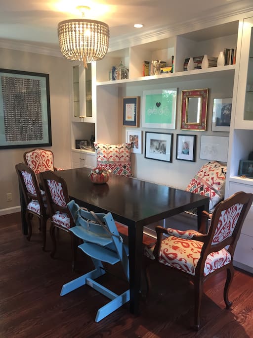 Dining room with custom built-ins and art.