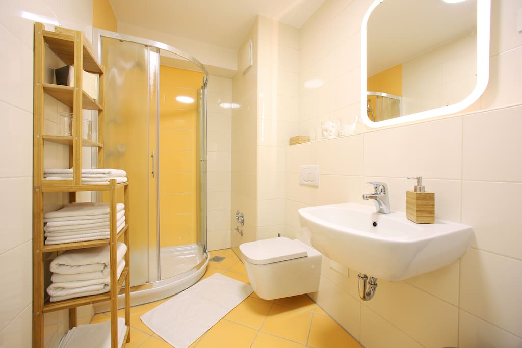 The bathroom is spacious, well lit and meticulously clean. It comes with towels and complimentary shampoo/shower gel.