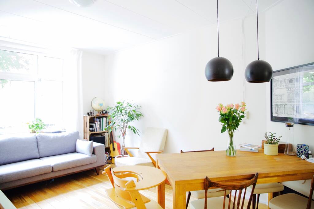 living room with comfortable corner sofa and 4 seater dining table