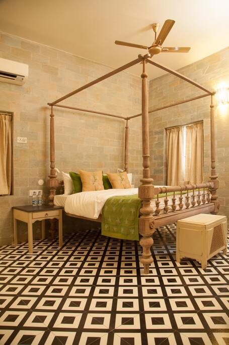 Tuberose room with antique poster king bed