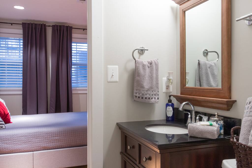 Private bathroom with bath soap, towels, etc.