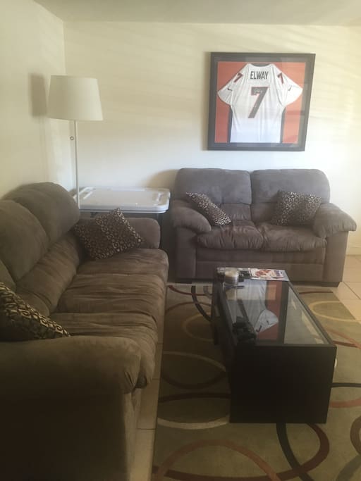 Living room with plush oversized couches and coffee table