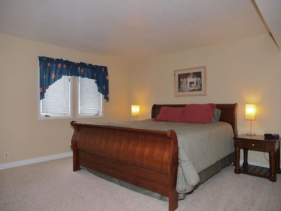 master bedroom with king bed and hdtv with directv