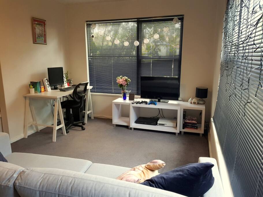 Cosy yet spacious lounge room with 3-seater couch