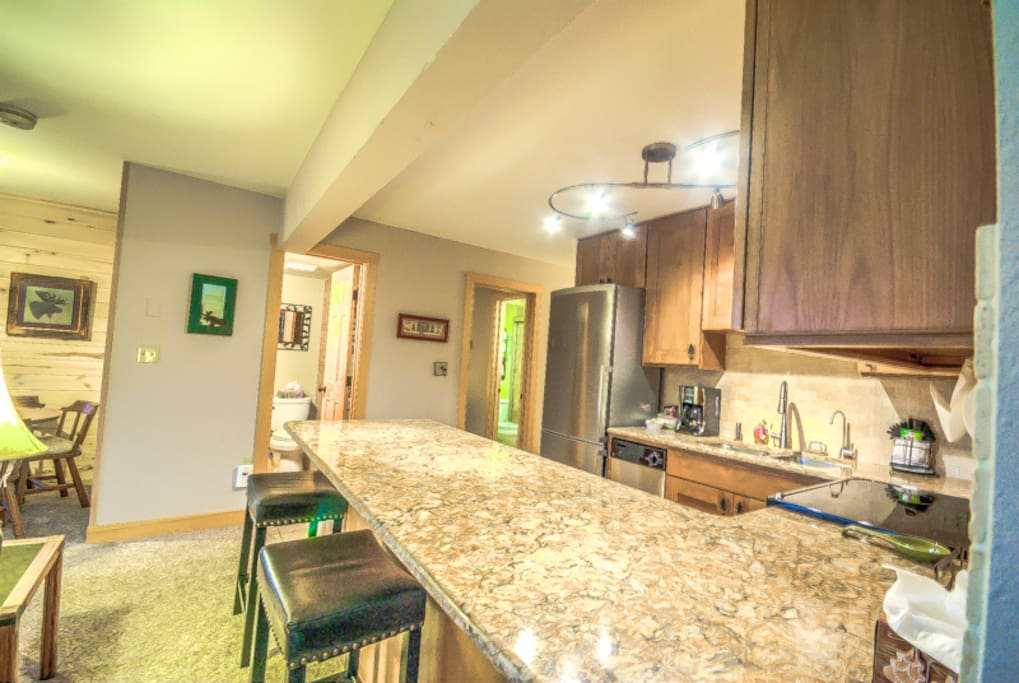 Fully Remodeled Kitchen With Granite Countertops and Stainless Steel Apliances