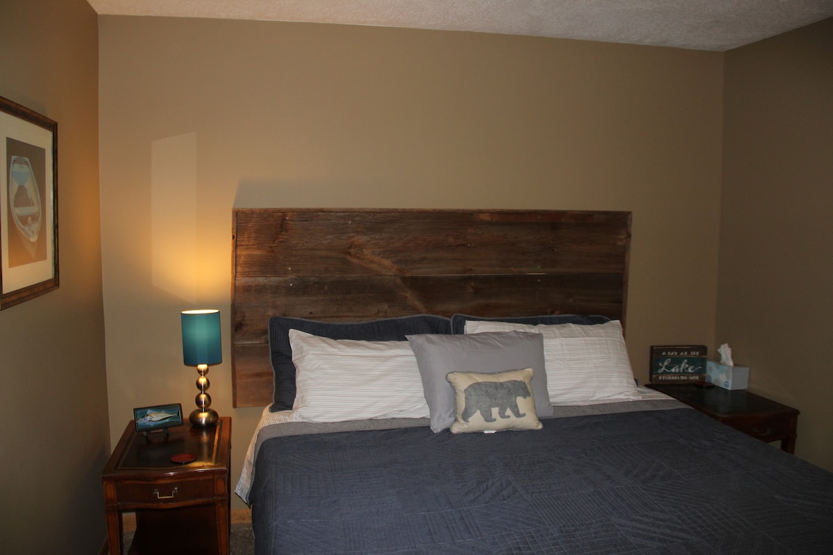 Upper Level Bedroom 2 with King and custom made headboard by owner