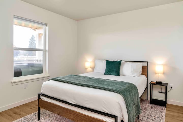 Bedroom 2: With a queen bed and  office space, ideal for remote work.