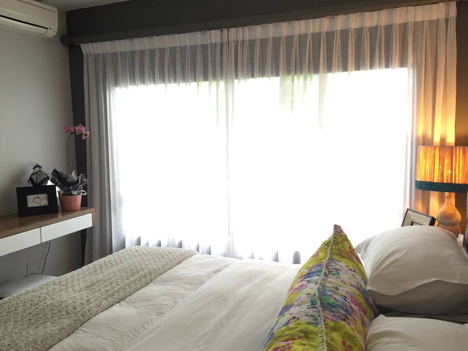 Main bedroom which has an air conditioning unit as well as Built in cupboards, dressing table and king size bed with lovely Egyptian cotton bedding and a feather duvet.