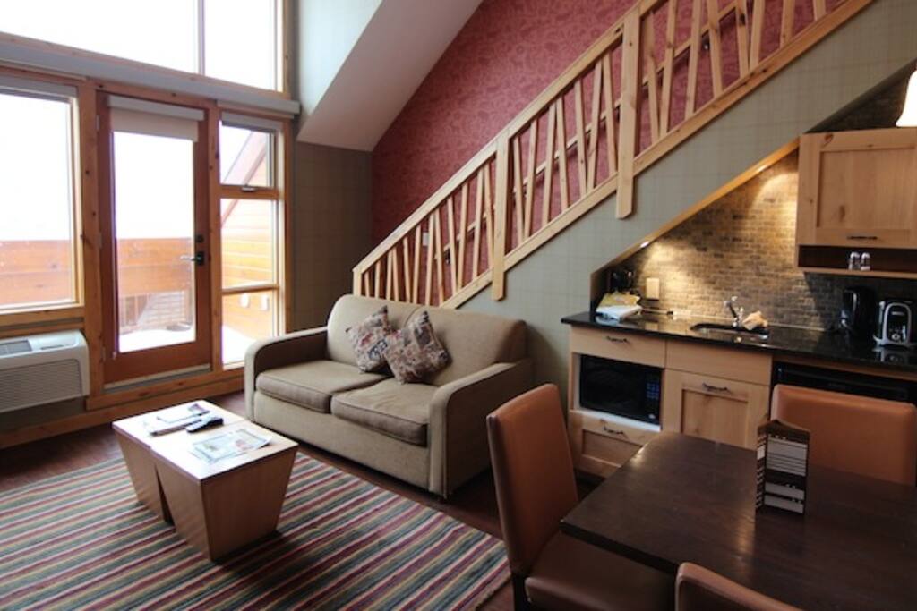 Bright and spacious living area with a balcony