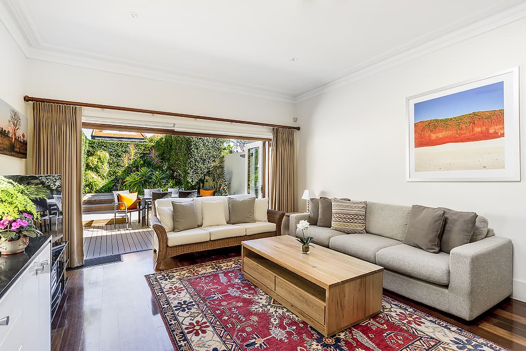 Spacous living room opens onto backyard