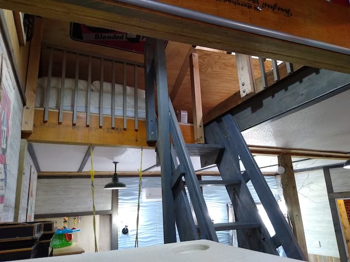 Steep "Tiny Home" Stairs with Storage that lead to the Loft Area with Three Full Size Mattresses