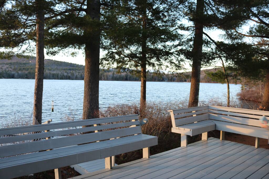 Large deck looks out on the water and the mountains
