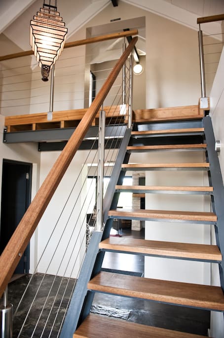 Staircase to two double en suite bedrooms on first floor