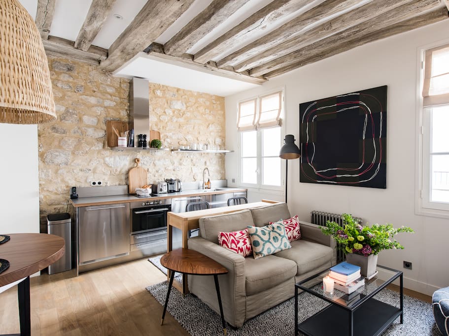 The 1 level of the flat: living room with the kitchenette, TV zone and dining area