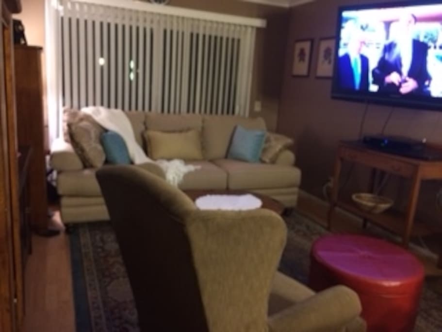 The living room features traditional American furniture.