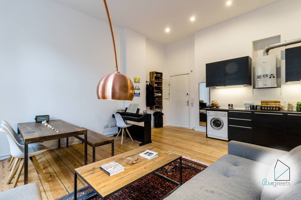The living room is open designed and includes a living and dining area as well as the kitchen.
