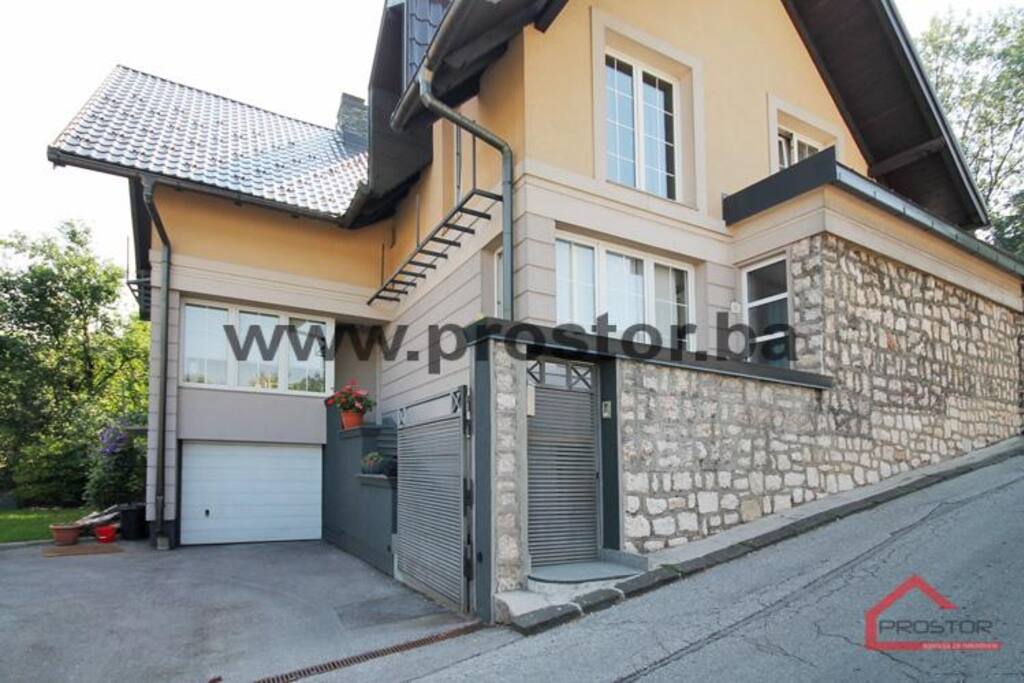 The entrance to the house and parking space