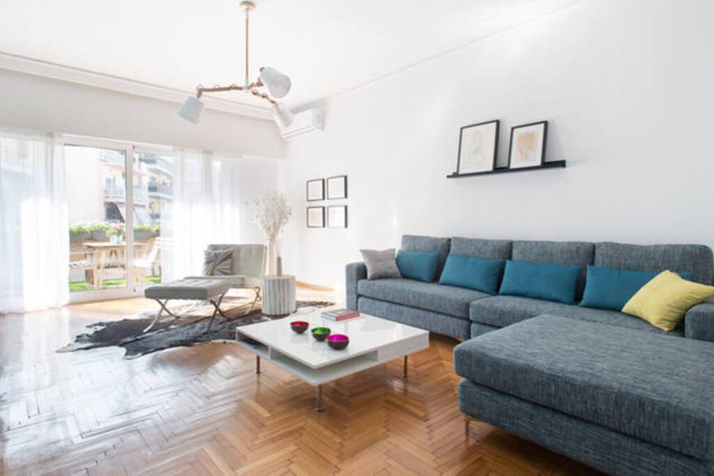 spacious living room with sofa - lounge chair - coffee table - bar - TV