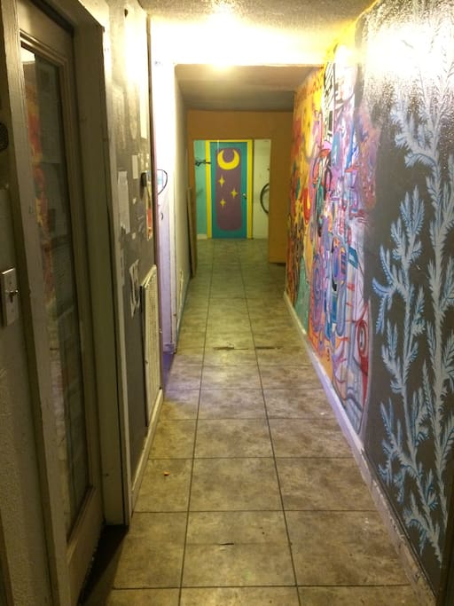 Hallway of murals, right outside room