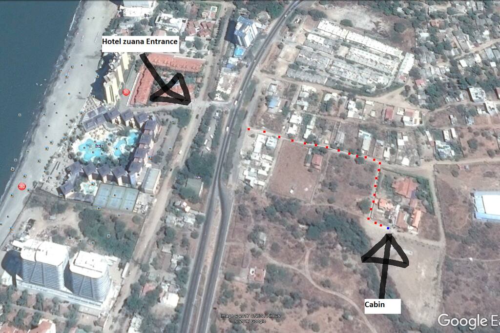 You can get off from the bus at the Hotel Zuana entrance as indicated by the arrow and follow the red dots that will lead you to the house.