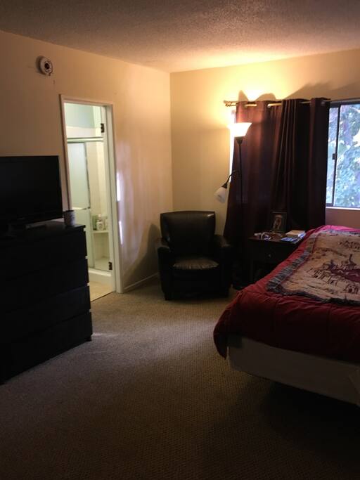 Private bedroom with doorway to private bathroom