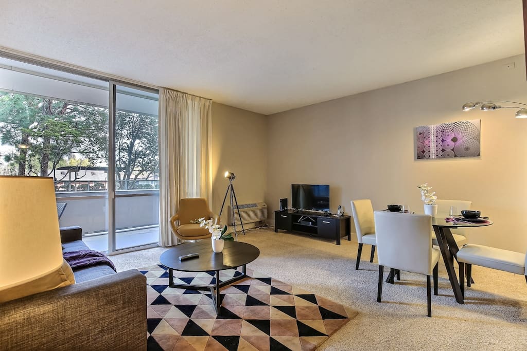 Living room, media center with 42" TV and dining area
