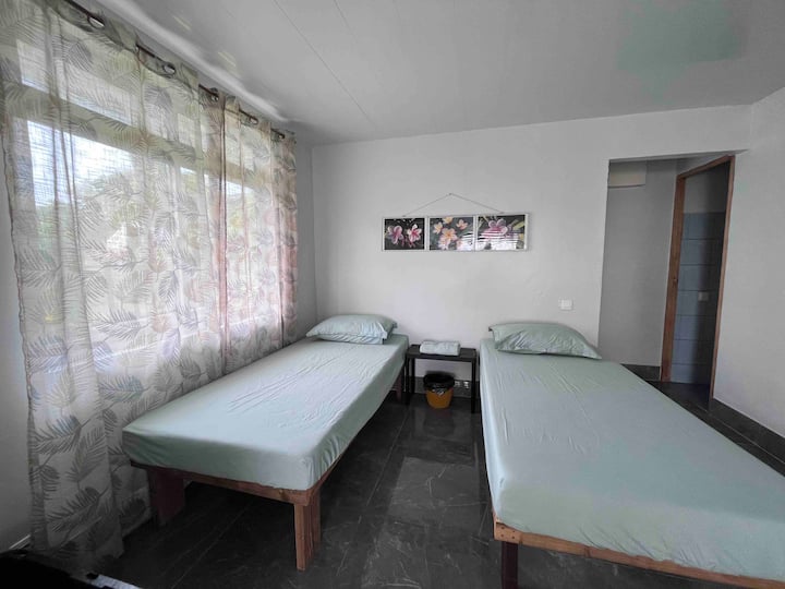 2 x 90x180 beds in the curtained living room