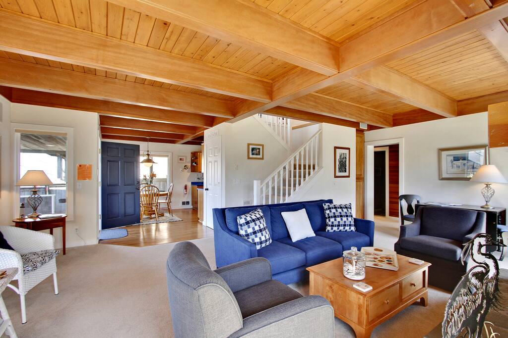Spacious living room with fireplace, game table, and Smart TV with DVD player for watching movies