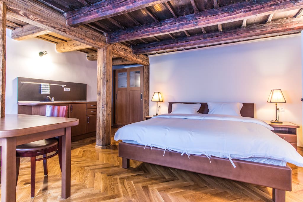 Wooden beams and queen sized bed