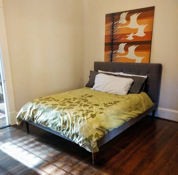 Queen sized bed with memory foam top in the guest bedroom