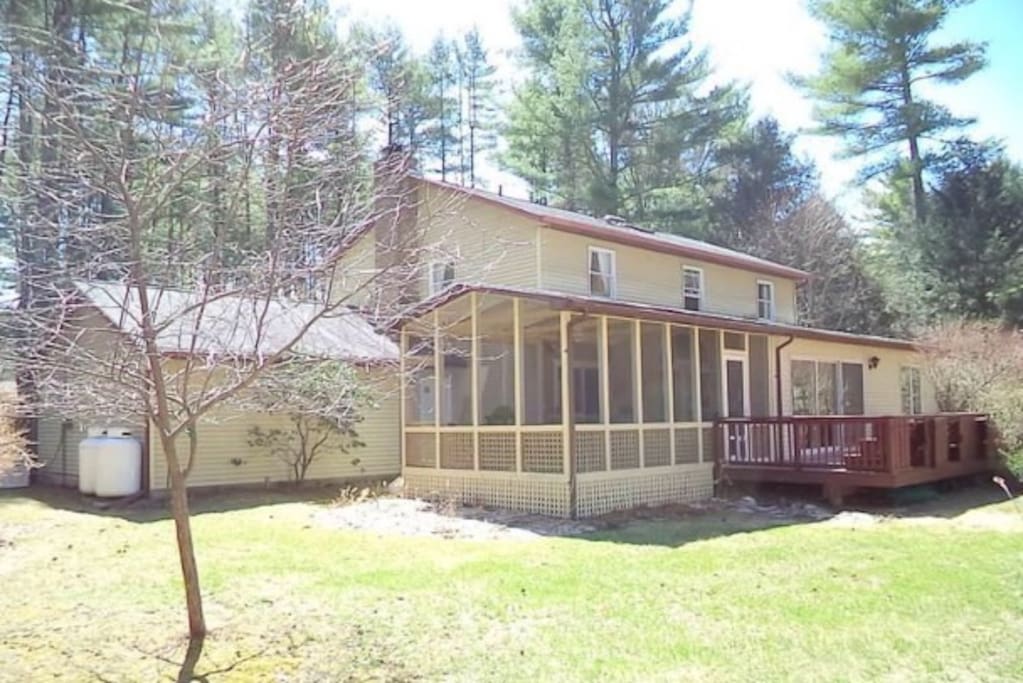 View of screened in porch at back of house