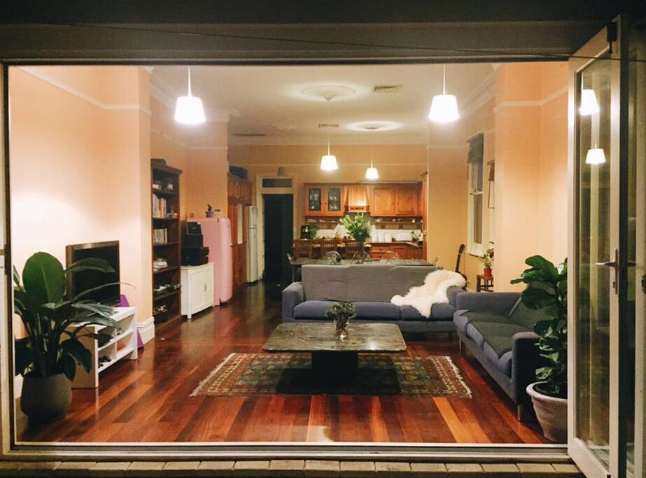 view from backyard looking into lounge, dining and kitchen