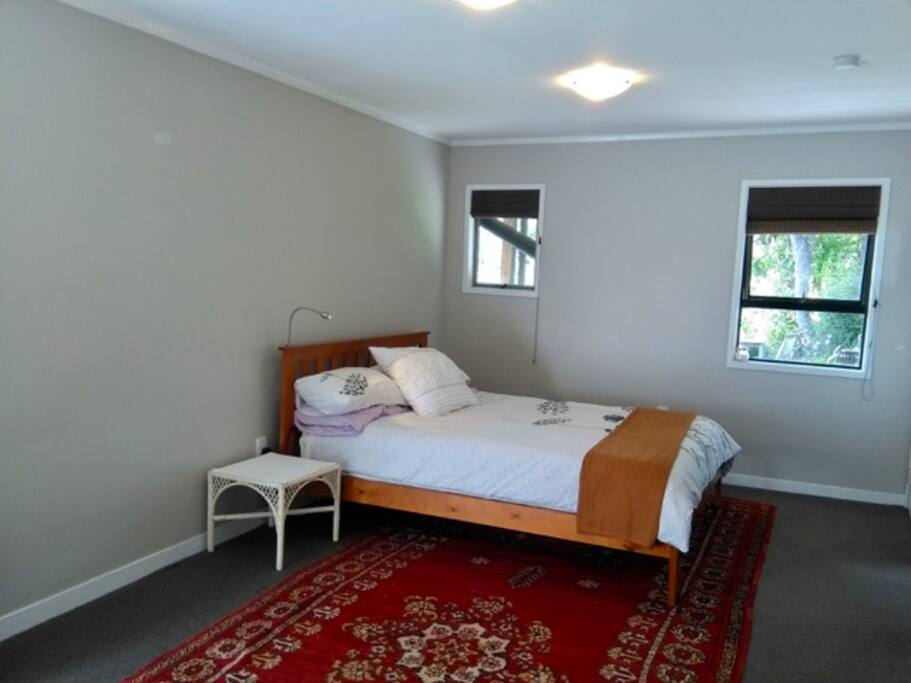 Bedroom with windows facing the garden