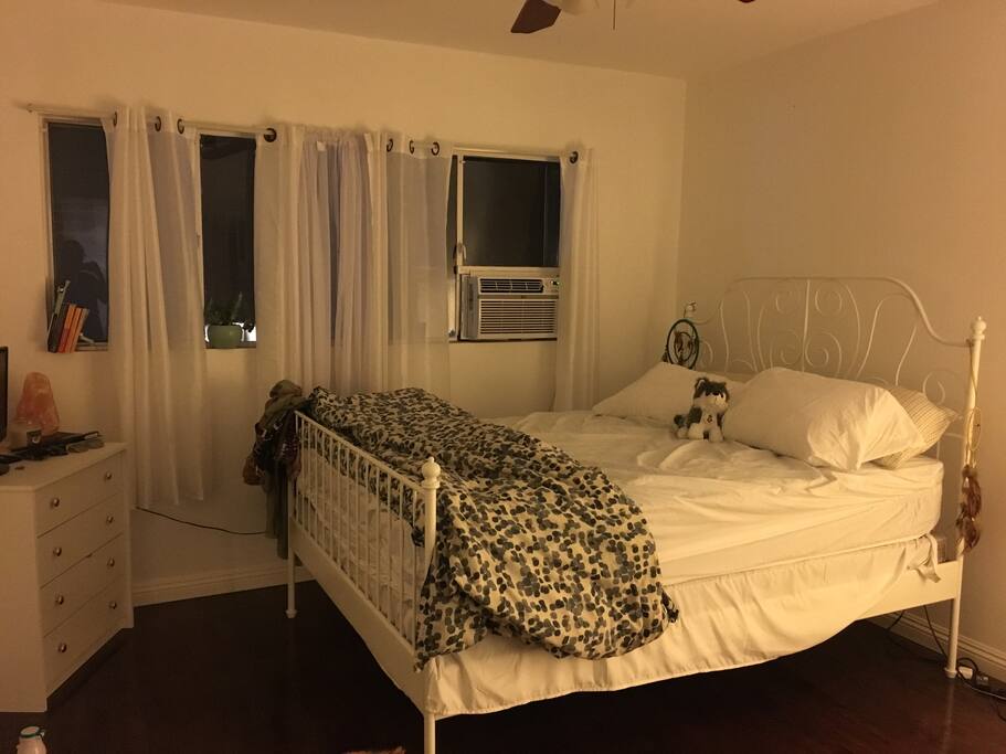 Bedroom with Queen bed, AC unit, and closet space available