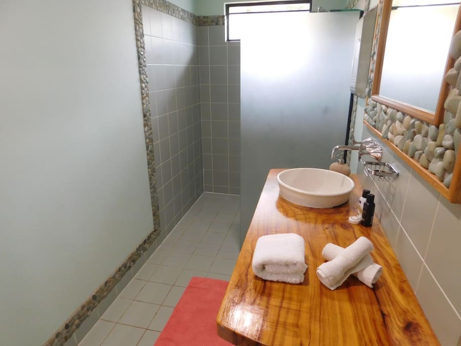 Modern Balinesse style en-suite with solid timber finish