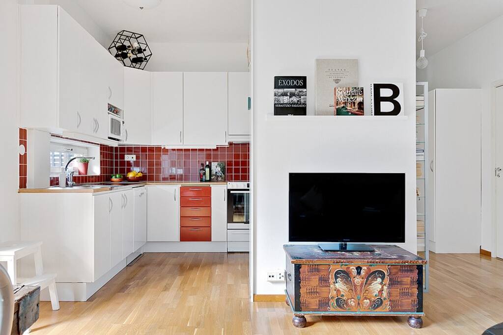 Kitchen located behind the living room with open space