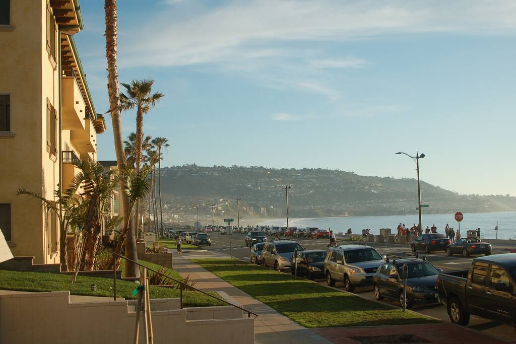 Side view of building with view of Palos Verdes and the ocean.