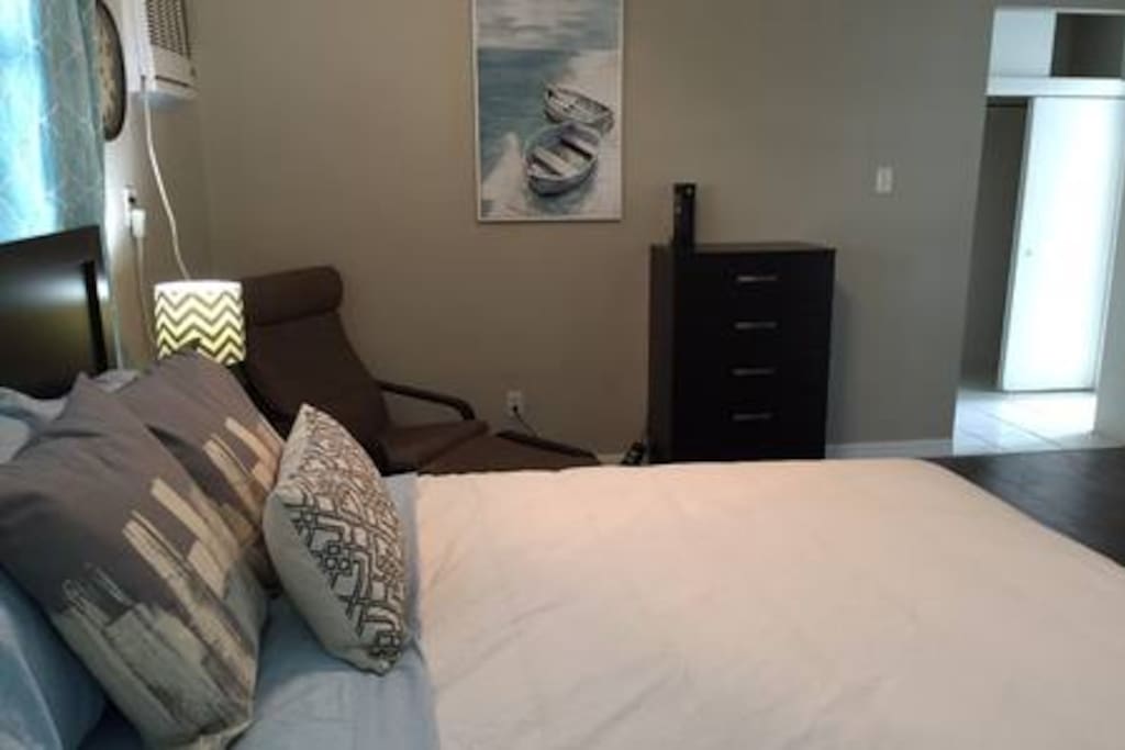Bedroom also includes a reading chair, closet and drawers. Bathroom for the unit is accessed through the bedroom.