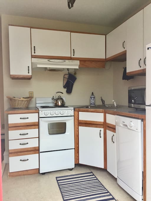 Here is the full kitchen that greets you as you walk in.