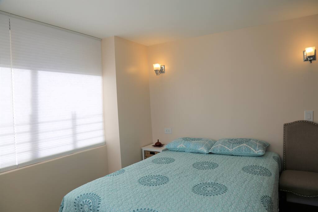 comfortable queen size bed with nightstand