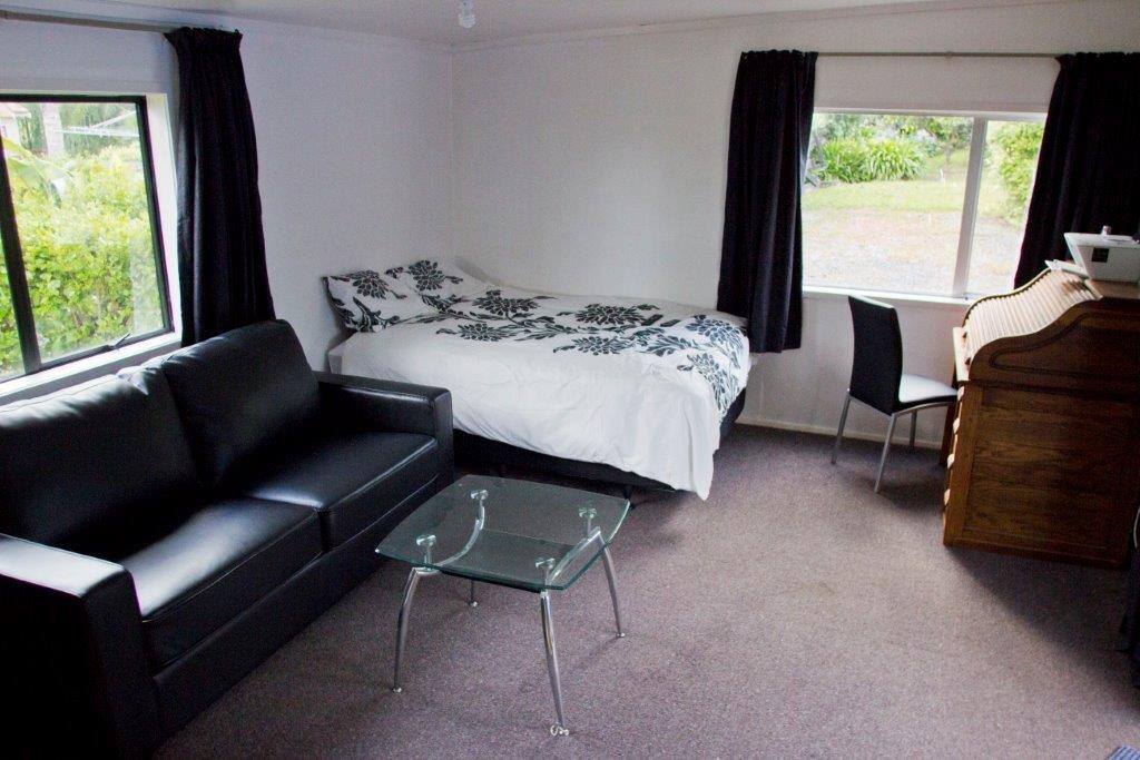 Queen bed. Desk does not show an added long table for laptop, printer/scanner