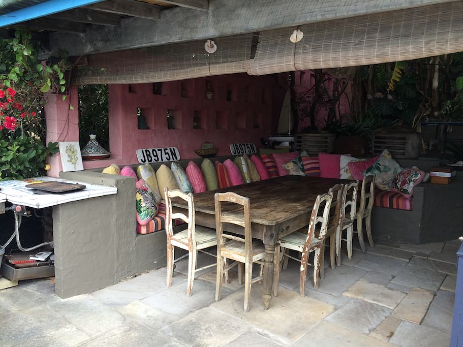 The gorgeous outdoor dining room is sheltered and comfortable and perfect to use all year round. It has 2 high pressure gas wok cooking burners, and a wood-fired pizza oven for outdoor cooking.