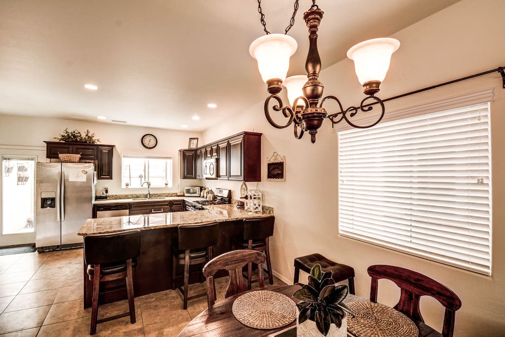 Kitchen with breakfast bar and dining area