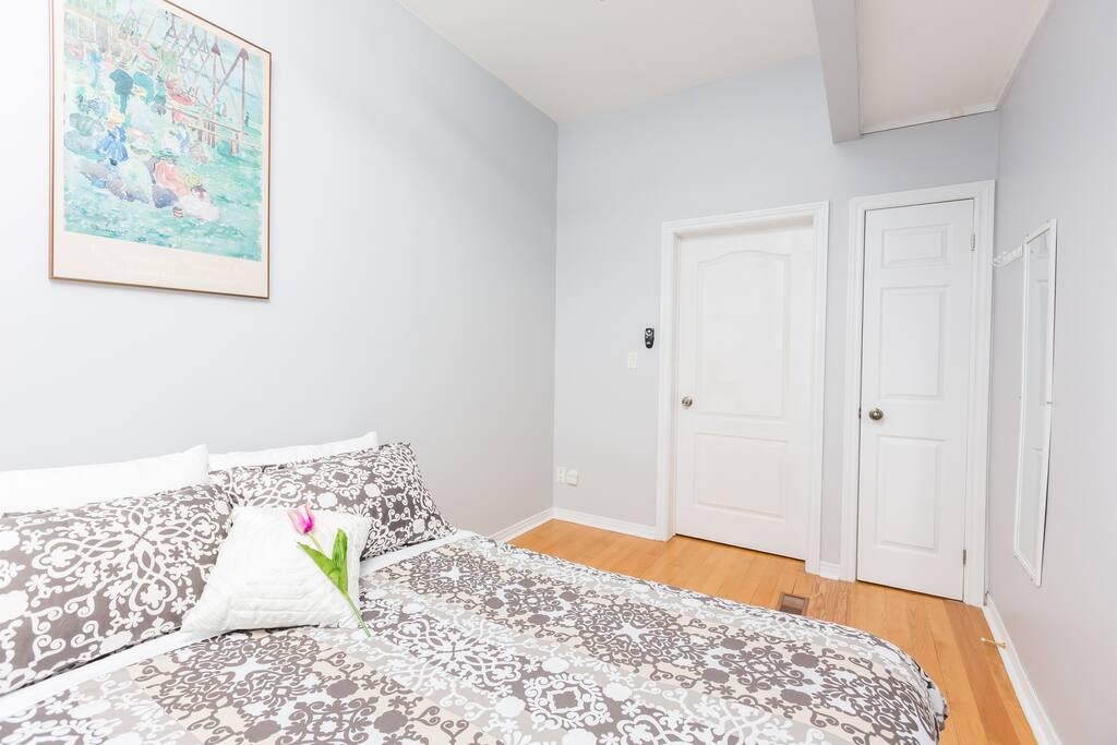 Bedroom #1 - Spacious Queen bedroom with a big window look out to Spadina Ave comes with a big built in closet.