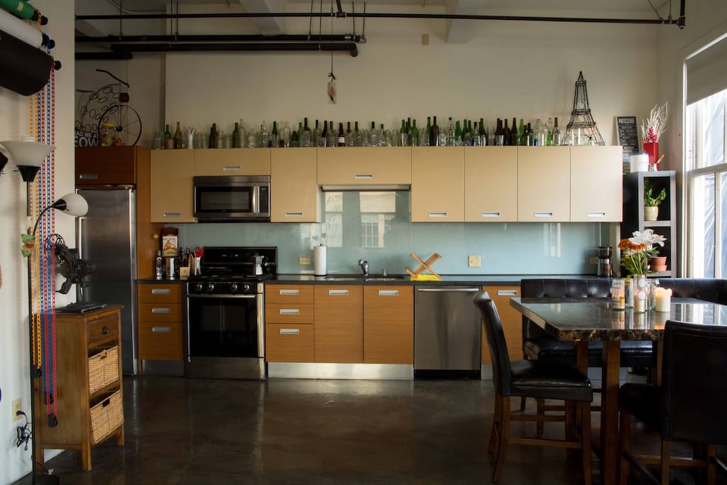 A kitchen full of every gadget imaginable, also all supplies needed for making fancy coffee