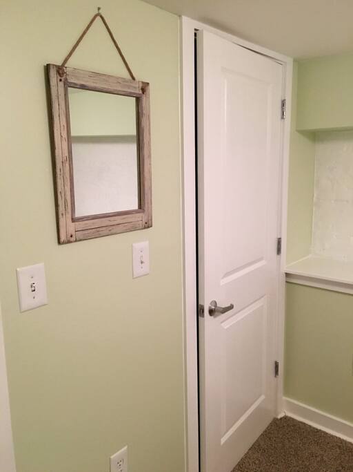 Full closet with hangers and shoe storage space.